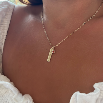 Ohio State Coordinates Bar shown on figure in gold with link chain and garnet gemstone