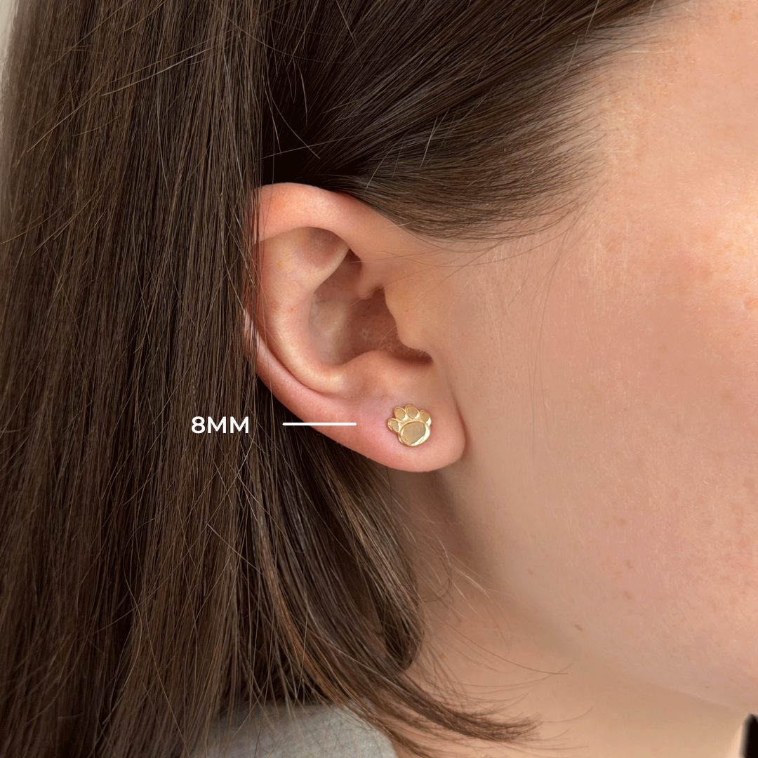 Penn State Paw Stud 8mm shown on figure in gold