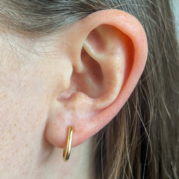 Mini U Hoop Earring shown on figure in gold