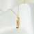 Navy Sapphire Gemstone Bar laydown shown in gold on cable chain