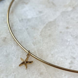 Starfish Charm shown on Neck Collar in gold