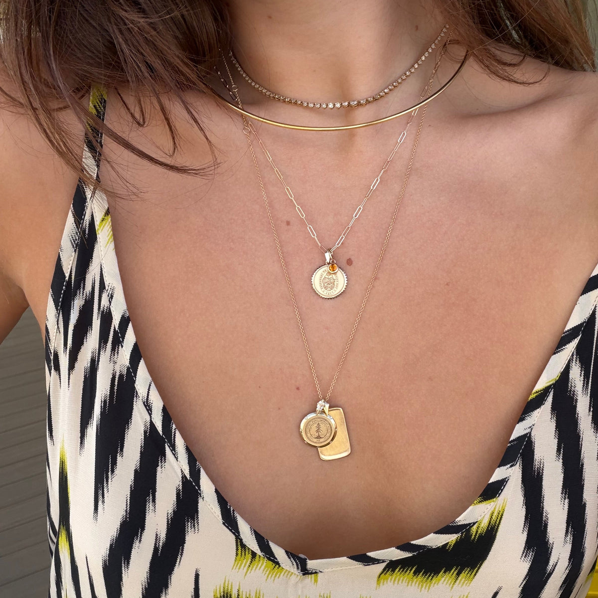 Tennessee Sunburst Bundle shown on figure in gold with Stanford 7-Point and Large Ingot Pendant in gold with Neck Collar