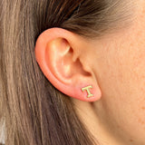 Tennessee T Stud shown on figure in gold in size 8mm