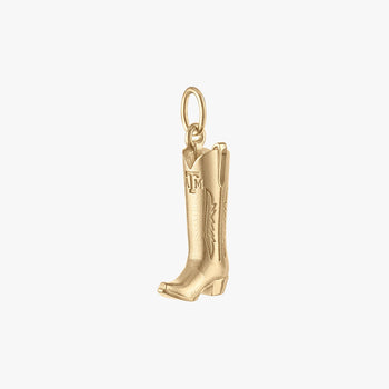 Gold cowboy boot charm on a white background