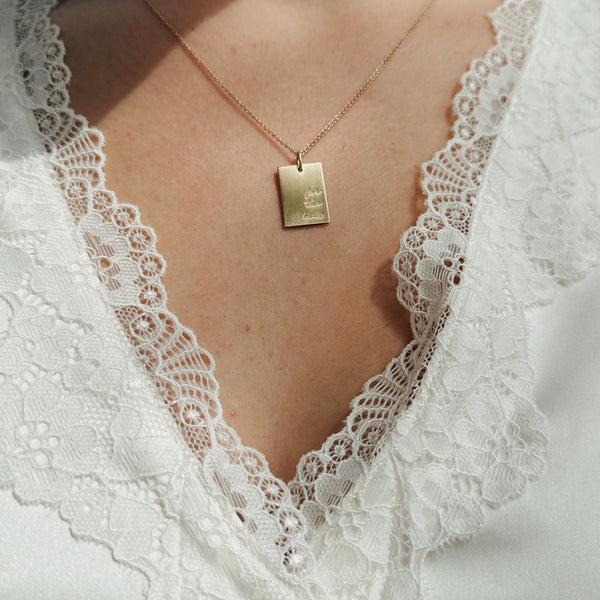 THON "For the Kids" Rectangle Pendant shown on figure in gold on Cable Chain