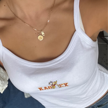 USC Logo Charm shown on figure in gold on Link Chain with USC Sunburst Pendant on Cable Chain in gold