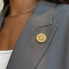 Wisconsin Union Lapel Pin shown on figure in gold