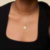 Zeta Tau Alpha Sunburst Necklace shown on figure in gold