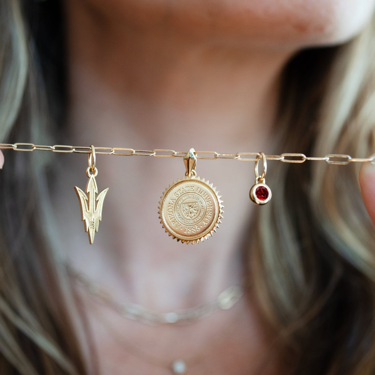 Arizona State Pitchfork Charm shown on Link Chain with Arizona State Sunburst and Garnet Gemstone in gold