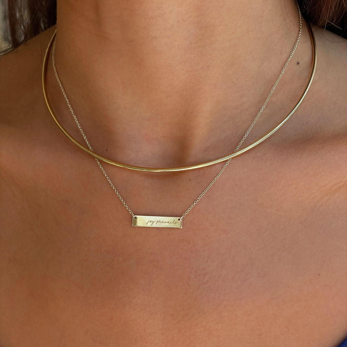 Kentucky Dance Blue "Joy Prevails" Horizontal Bar Necklace shown on figure with Neck Collar in Cavan Gold