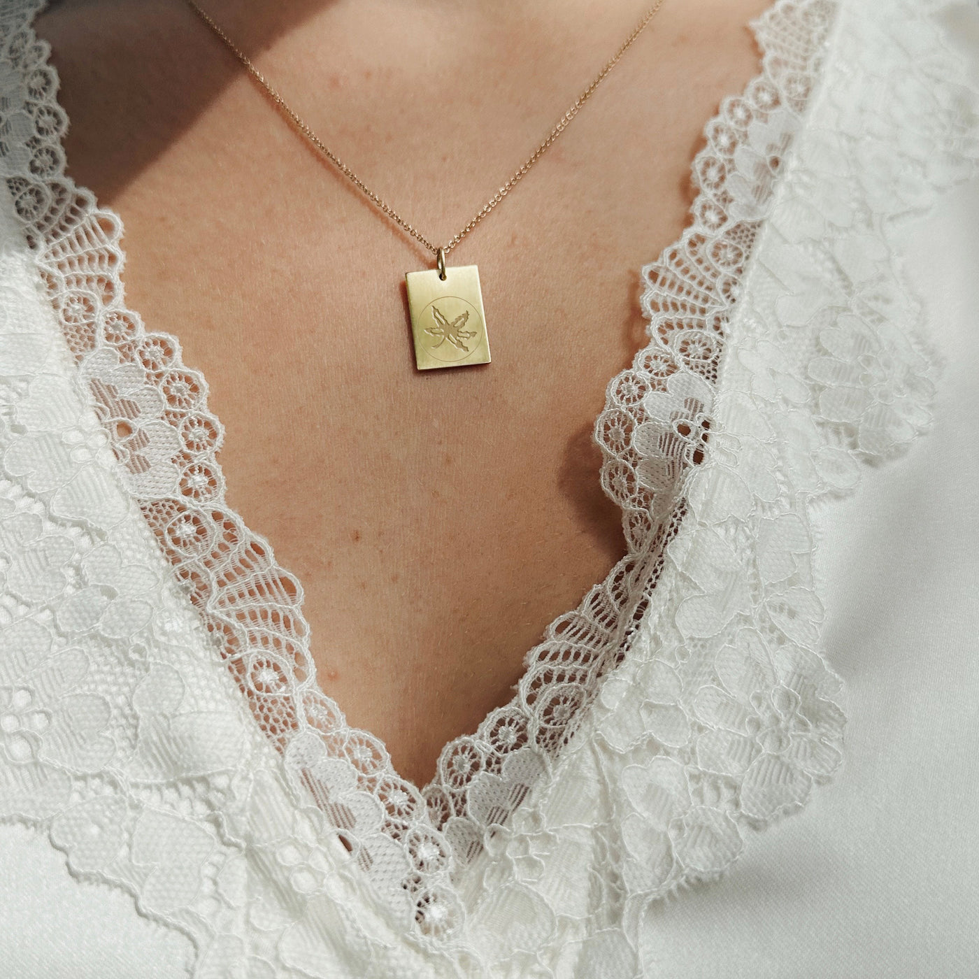 Ohio State Limited Edition 2024 Championship Buckeye Pendant shown on figure in gold on Cable Chain