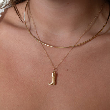 Cowboy Boot Charm shown on figure in gold on Cable Chain with Neck Collar in gold
