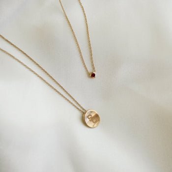 USC SC Petite Necklace and Garnet Gemstone Necklace laydown shown in gold