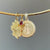 South Carolina Gamecock Charm, Garnet Gemstone, and South Carolina Seal Sunburst Pendant shown in gold on Neck Collar