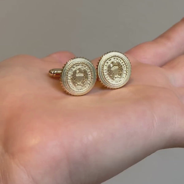 Texas A&M The Association 3D Sunburst Cufflinks shown in hand in gold