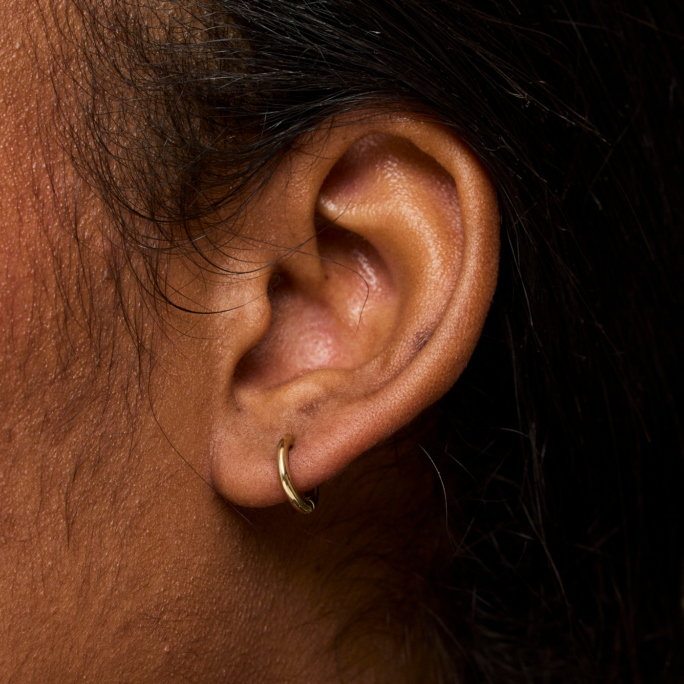 Gold Huggie Hoop on Figure 