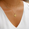 Gold Sigma Delta Tau Sunburst Crest Necklace on Model